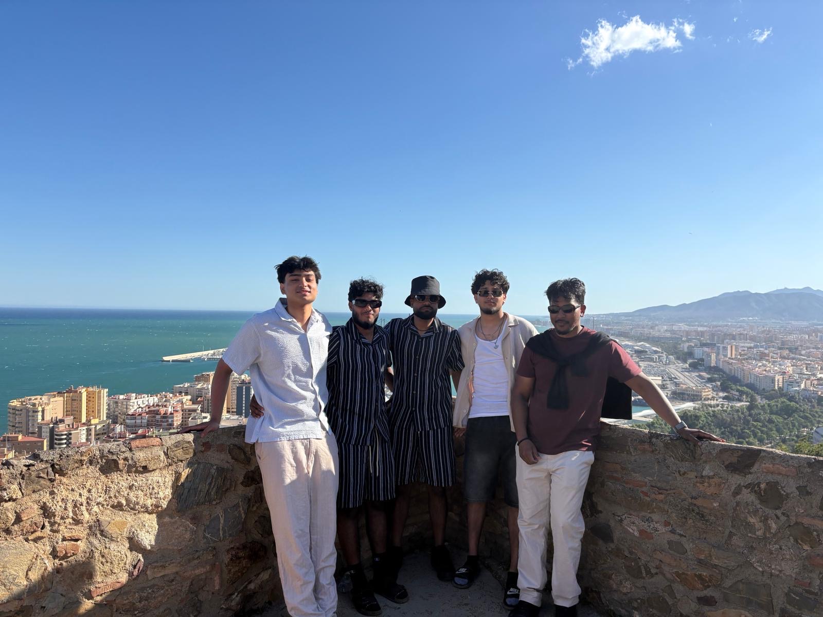 Friends overlooking a coastal city and the sea