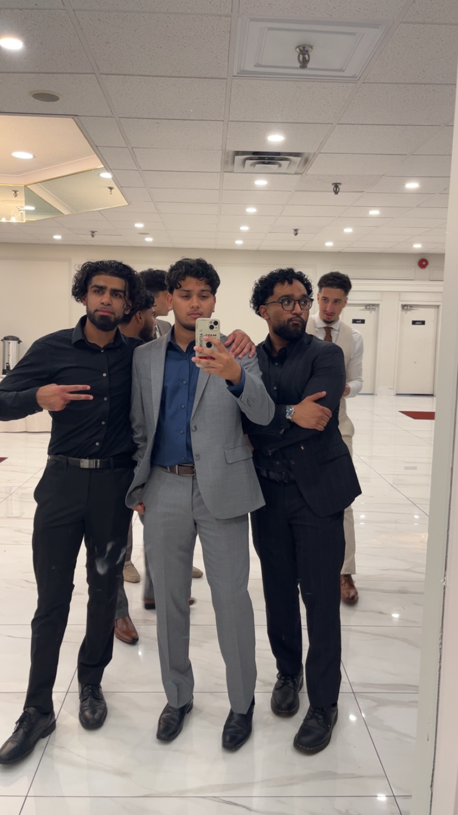 Friends posing together in formal clothes