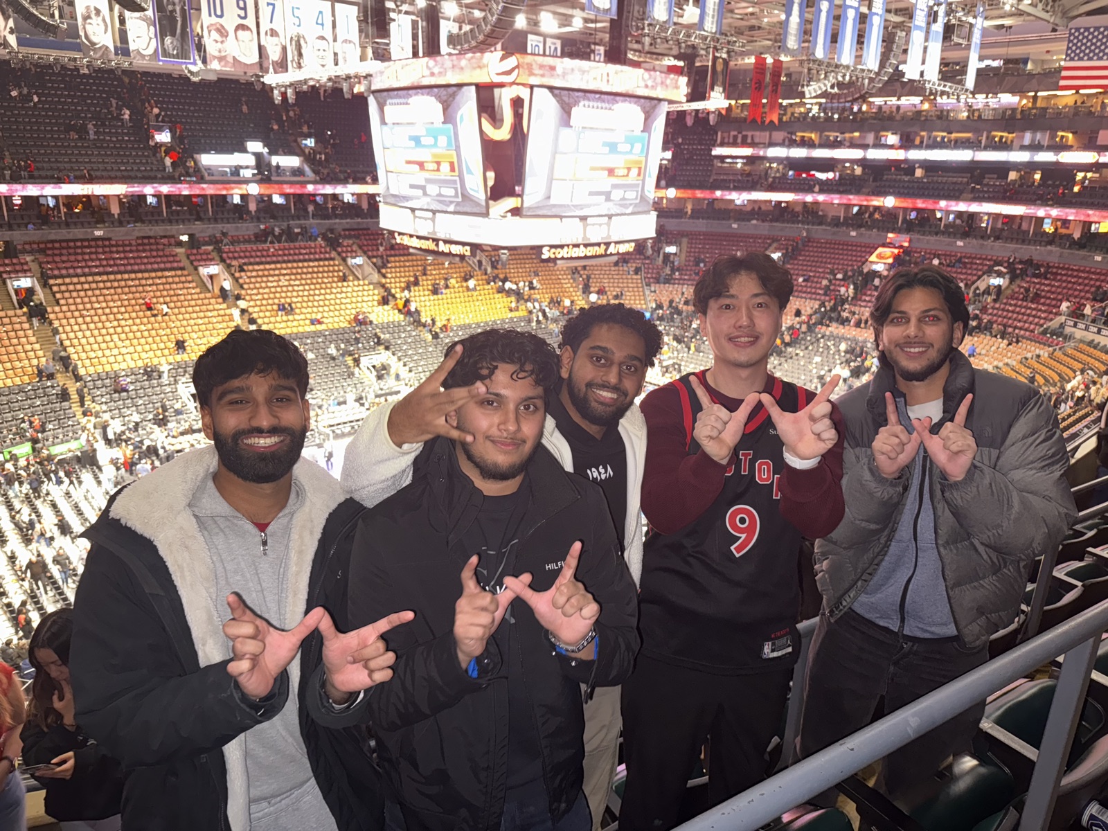 Friends at a basketball game in Scotiabank Arena